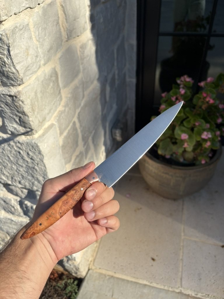 Handmade knife with initials etched into the burl handle